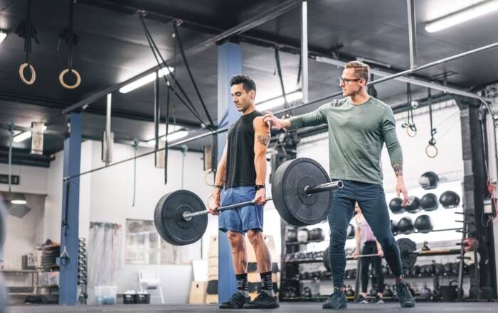 a man with a coach in gym