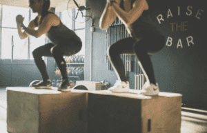 Women doing box jumps