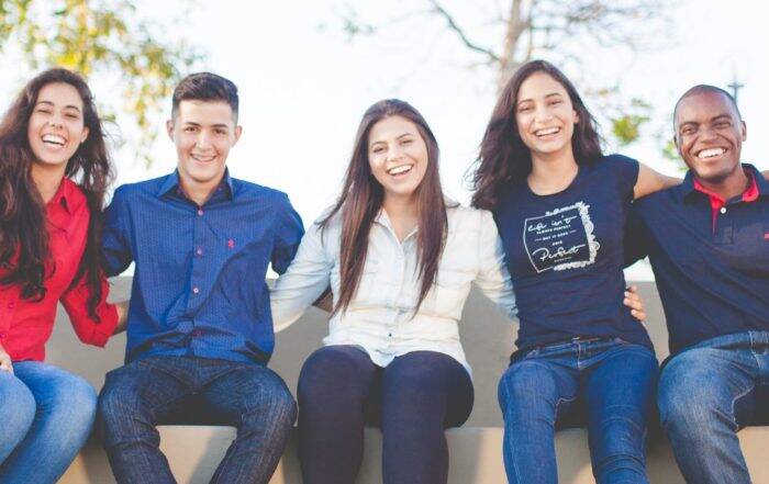 Image of students posing outdoors for a photo.