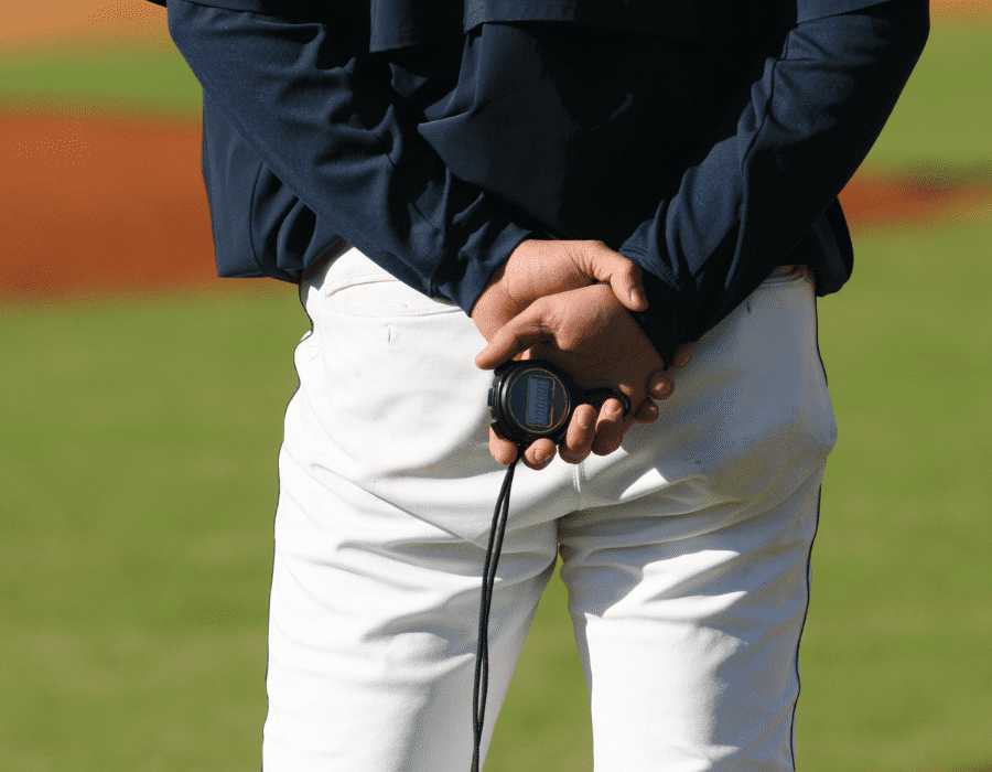 image of coach holding stop watch