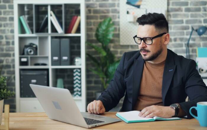 Professional adult learner applying to an online degree program from home