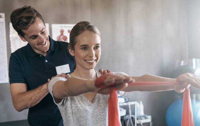 Image of physical therapist working with a client.