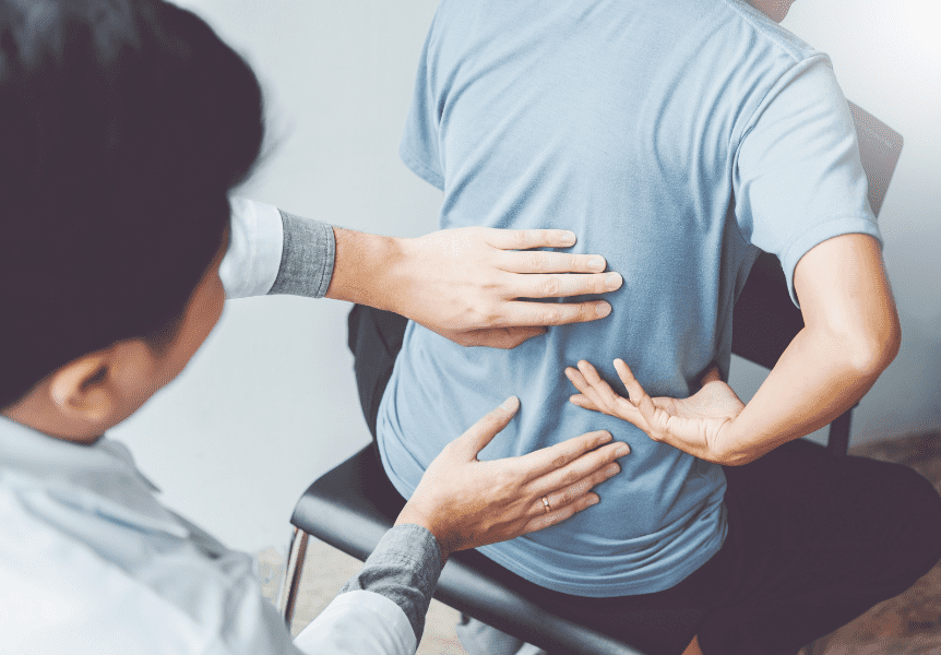 Image of a physical therapist assisting a client.