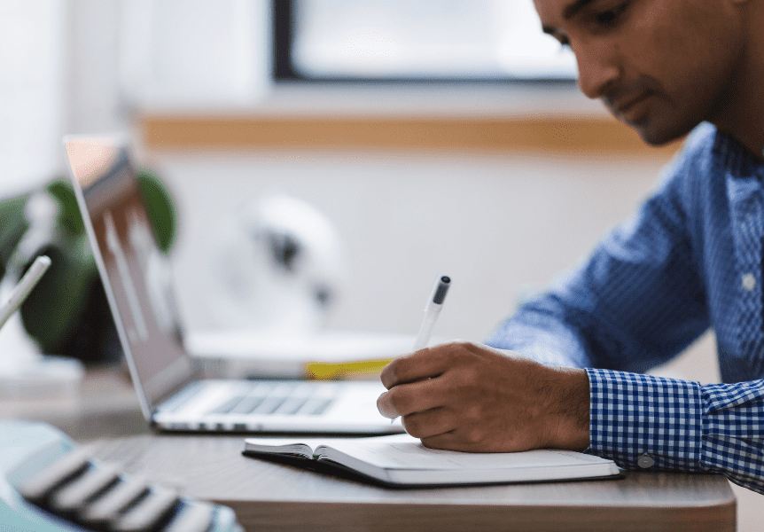 Image of a man studying at his computer.