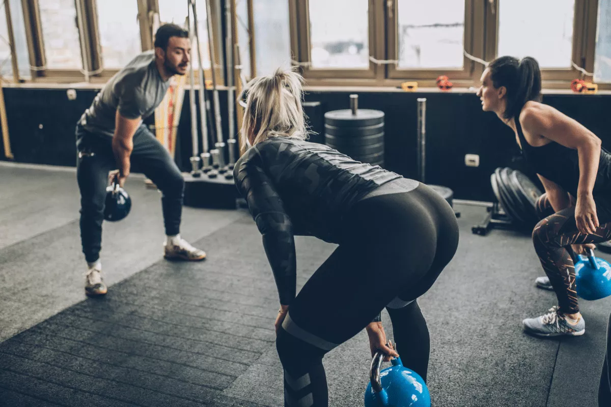 Image of a strength coach working with clients.