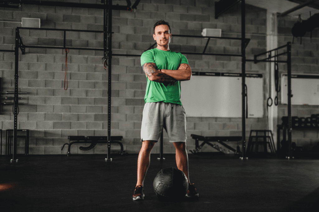 a man standing in gym a man standing in gym